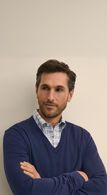The Perfect Pairing: Our premium sweaters layered over our iconic button-downs: instant refinement.